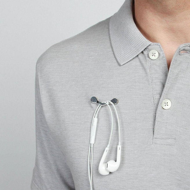 Magnetic earphones holder for wire management