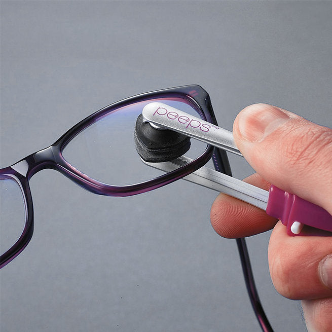 Carbon-charged lens cleaning pads